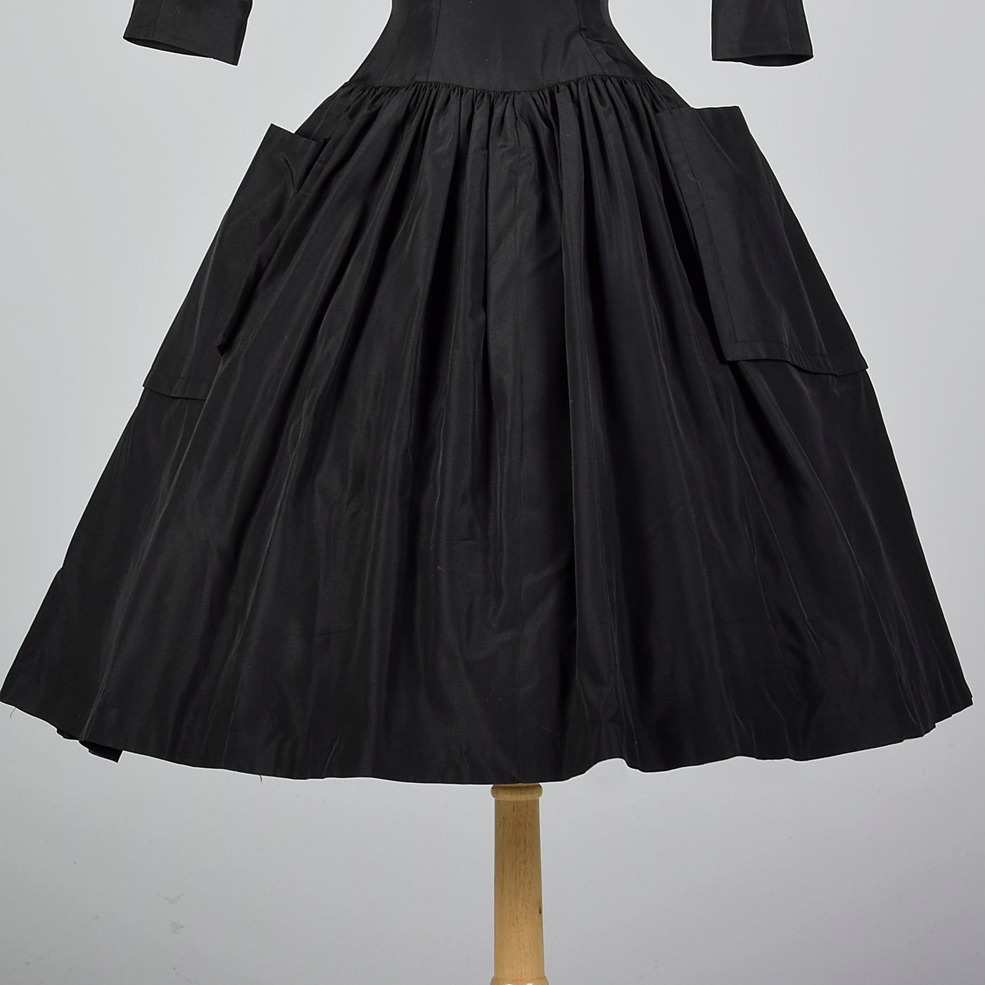 1950s Black Dress with Full Circle Skirt and Patch Pockets